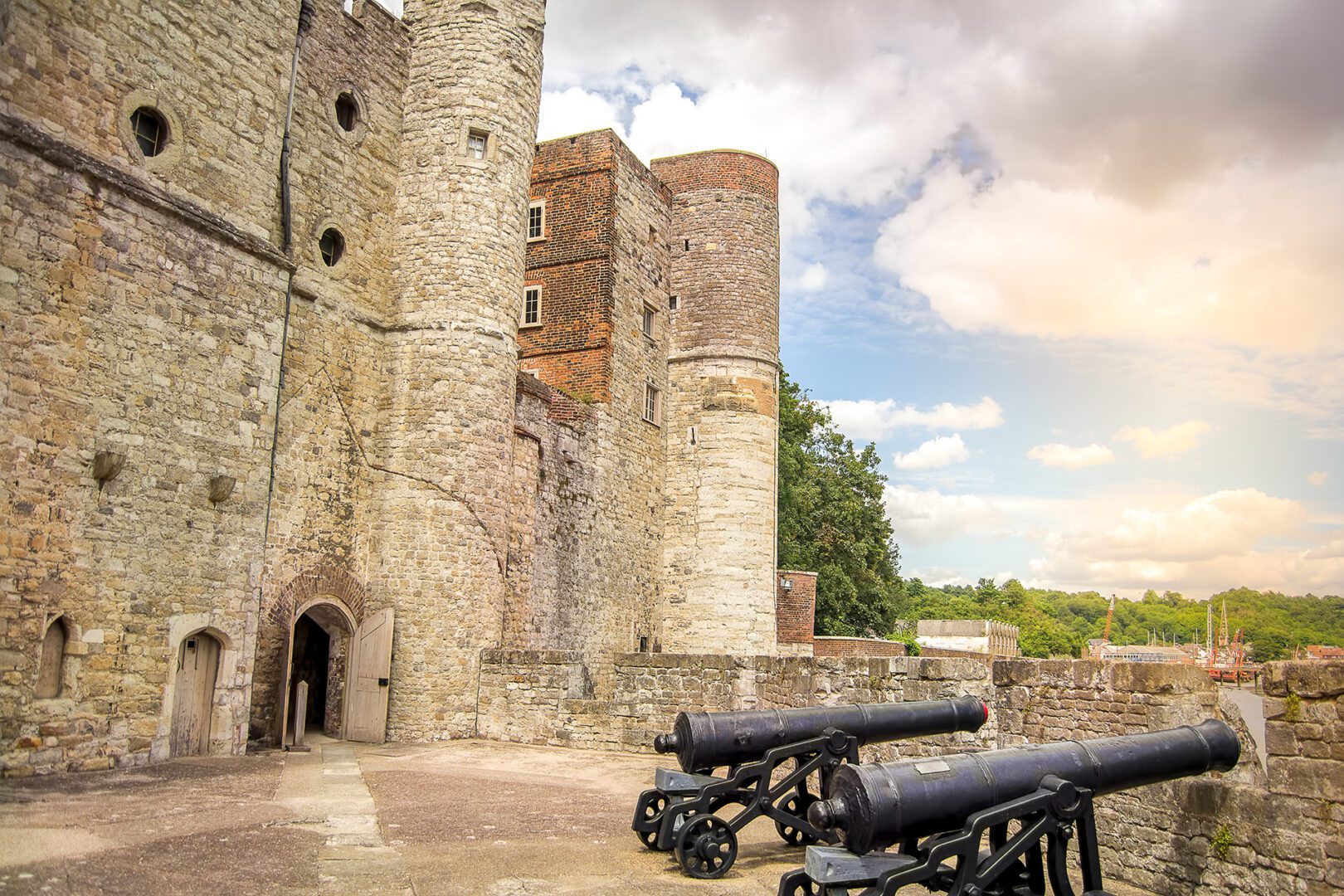 A castle with two large guns on the ground