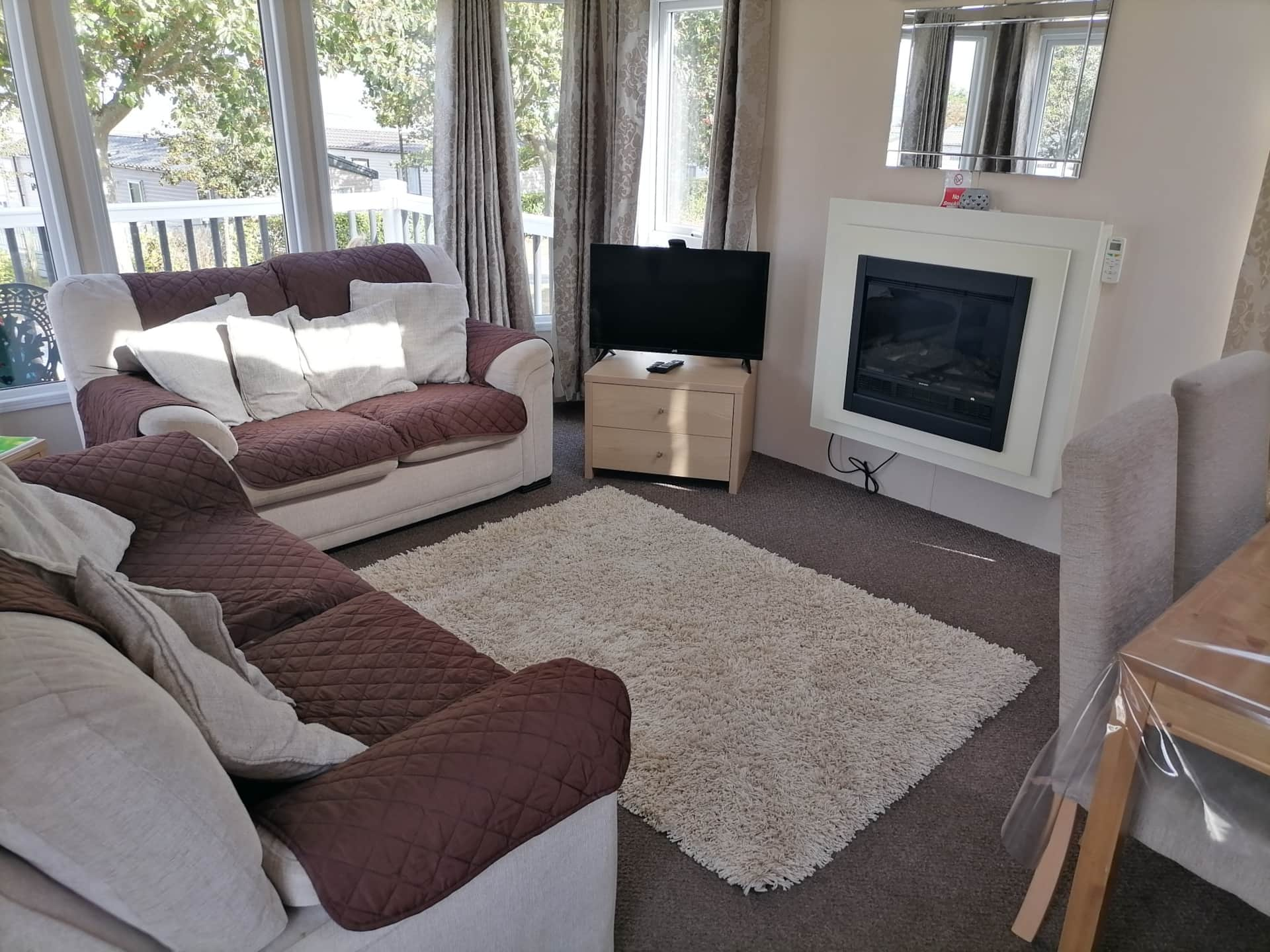 A living room with two couches and a television.