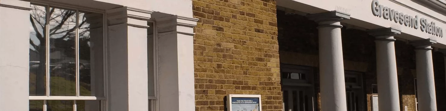 A brick wall with a sign on it